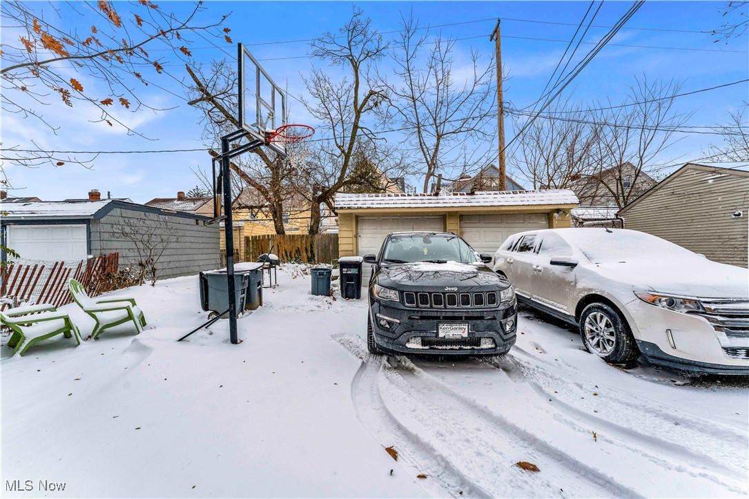 3597 Normandy Road Cleveland, OH 44120 - Photo 2 of 26 Yard layered in snow featuring a garage