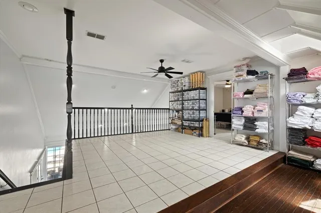 a bedroom with a bed and a chair