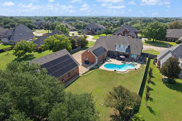 an aerial view of a house with garden space and outdoor space
