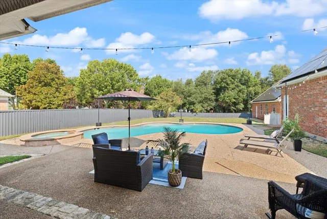 a view of balcony with wooden fence