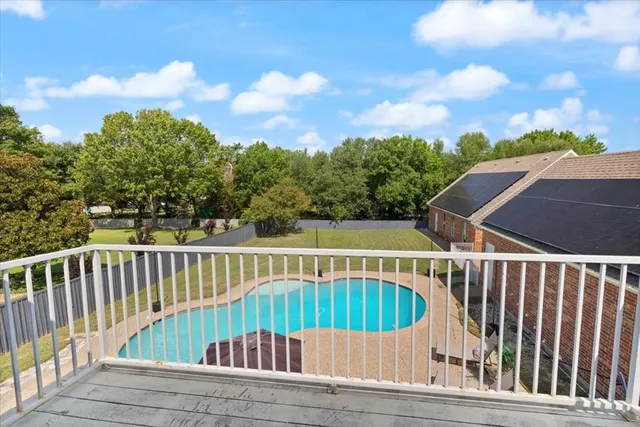 a front view of house with wooden fence