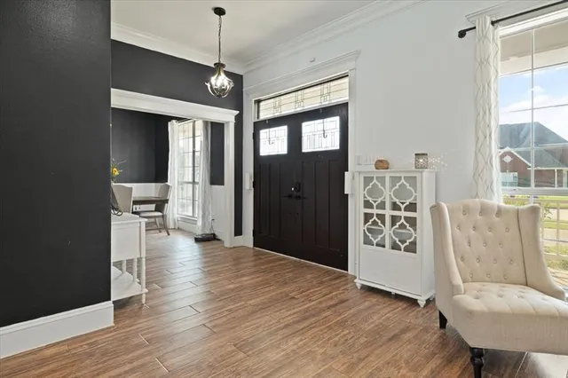 a view of a livingroom with furniture and wooden floor