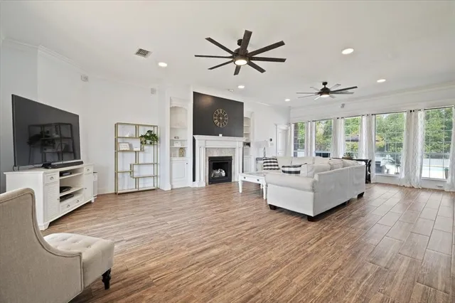 a living room with furniture fireplace and flat screen tv