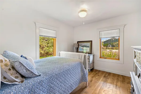 a bathroom with a sink a toilet and a large mirror
