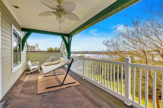 a bathroom with a granite countertop sink mirror vanity and toilet