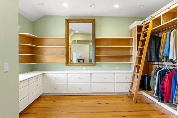 a view of room with furniture and wooden floor