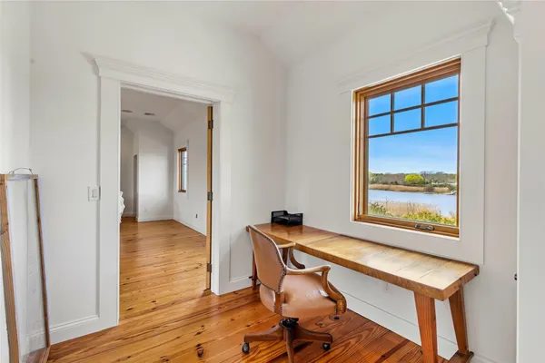 a spacious bedroom with a bed and a table