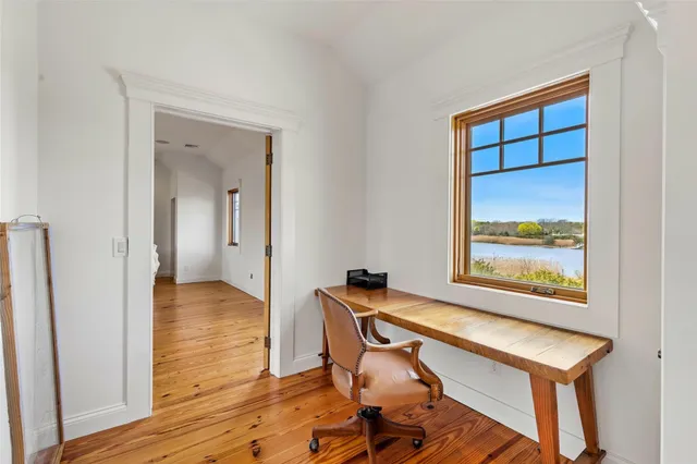 a spacious bedroom with a bed and a table
