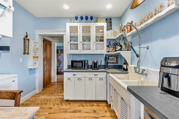 a kitchen with stainless steel appliances granite countertop a sink and a stove