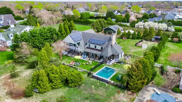 an aerial view of a house with a garden