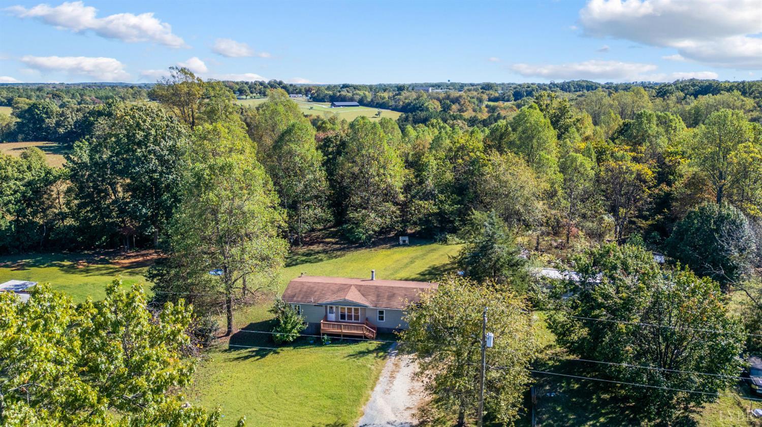 630 Eldon Road Appomattox, VA 24522 - Photo 36 of 37 a view of a yard with swimming pool and outdoor seating