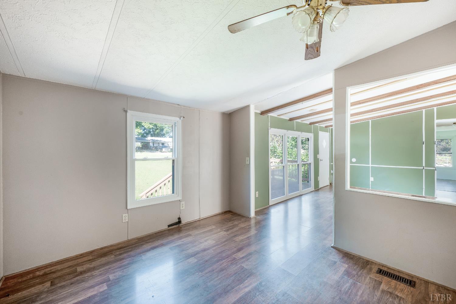 630 Eldon Road Appomattox, VA 24522 - Photo 9 of 37 a view of an empty room with a window and wooden floor