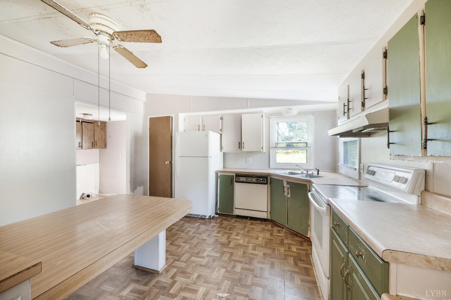 630 Eldon Road Appomattox, VA 24522 - Photo 10 of 37 a kitchen with a sink appliances and cabinets