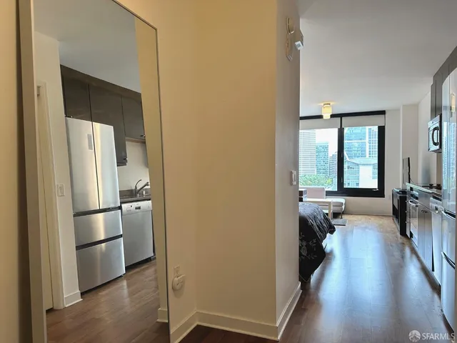 a view of a kitchen from the hallway