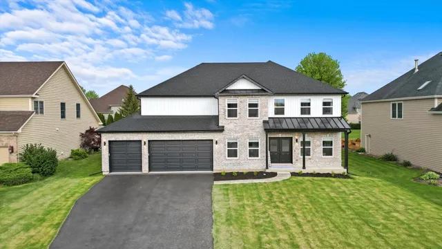 front view of a house with a yard