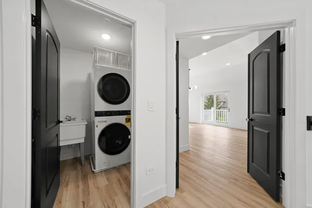 a view of a hallway with washer and dryer