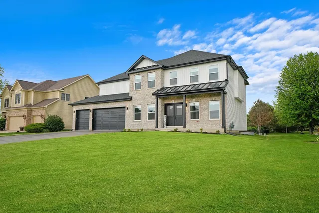 a view of a house with a big yard