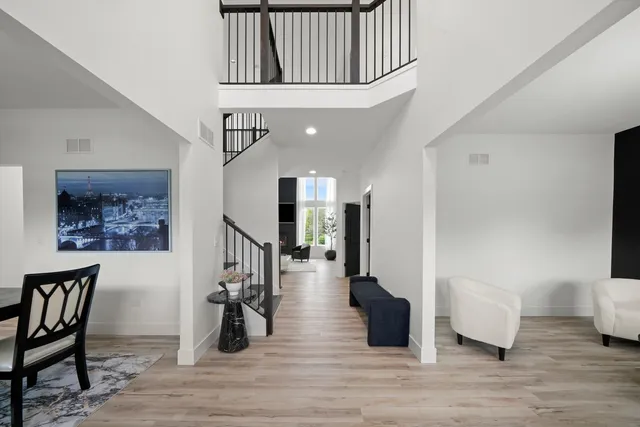 a view of entryway and hall with wooden floor