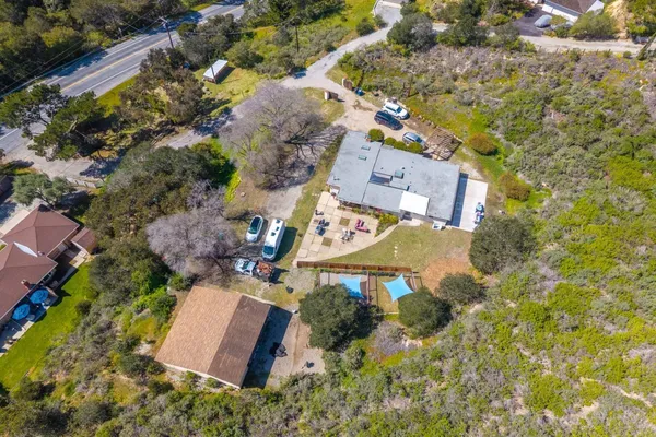 an aerial view of residential house with outdoor space