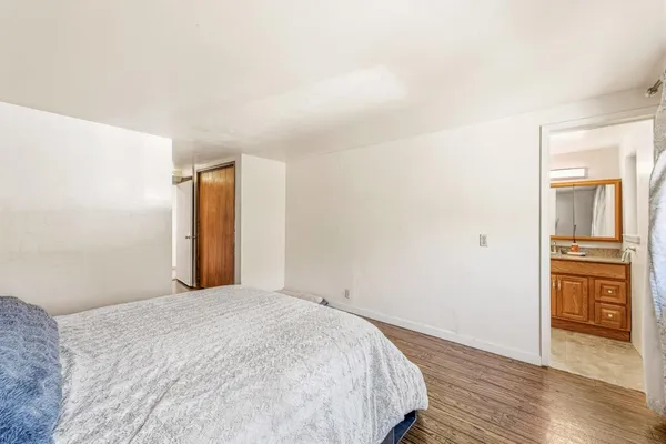 a view of a livingroom with wooden floor