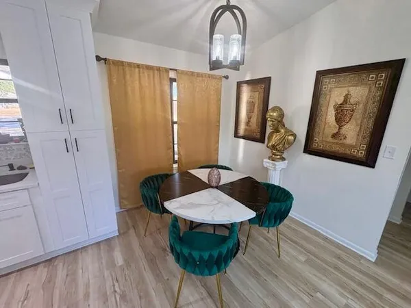 a table room with furniture and wooden floor