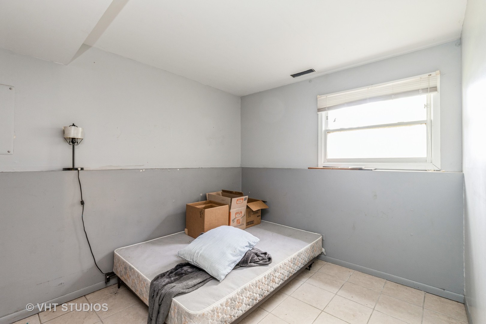 414 Garfield Road Ingleside, IL 60041 - Photo 11 of 13 a bedroom with a bed and window