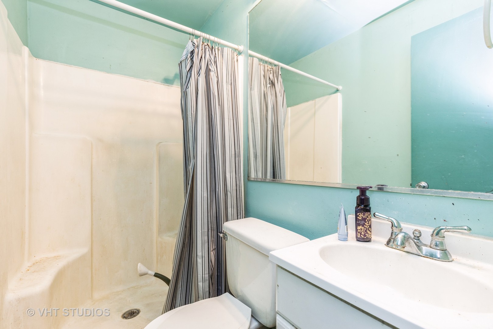 414 Garfield Road Ingleside, IL 60041 - Photo 12 of 13 a bathroom with a sink a toilet and shower