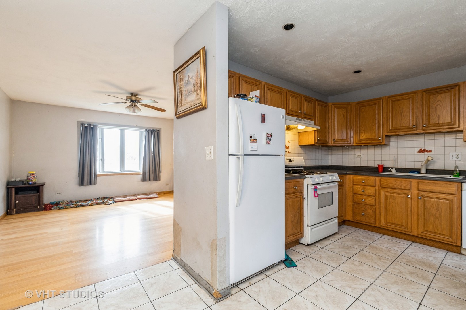 414 Garfield Road Ingleside, IL 60041 - Photo 8 of 13 a kitchen with granite countertop cabinets and refrigerator