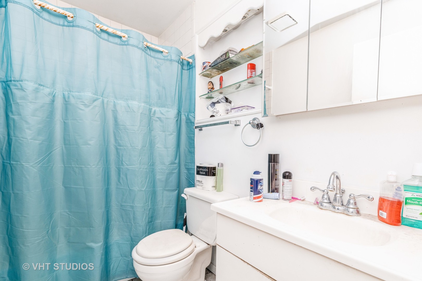 414 Garfield Road Ingleside, IL 60041 - Photo 10 of 13 a bathroom with a sink a toilet and shower curtain