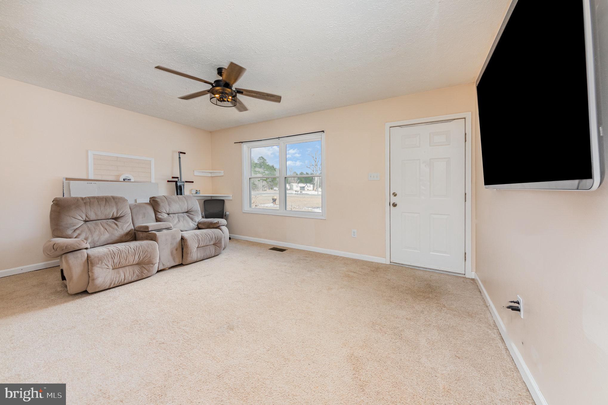 39 Twin Cedars Road Mineral, VA 23117 - Photo 3 of 21 a living room with furniture and a flat screen tv