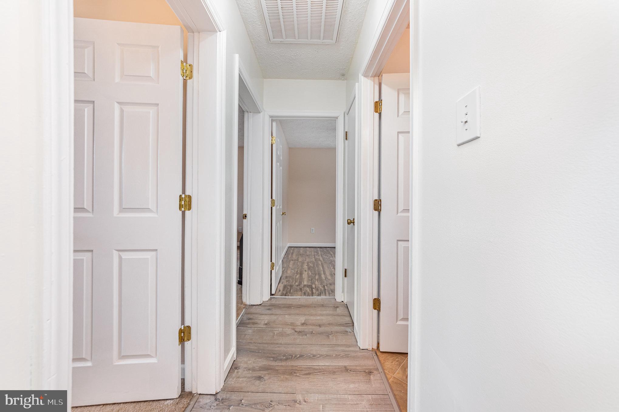 39 Twin Cedars Road Mineral, VA 23117 - Photo 8 of 21 a view of a hallway with wooden floor and closet