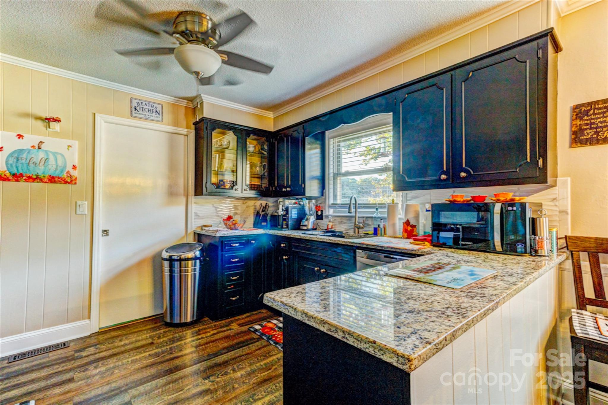 253 Suncrest Road Cherryville, NC 28021 - Photo 20 of 33 a kitchen with stainless steel appliances granite countertop a sink stove and refrigerator