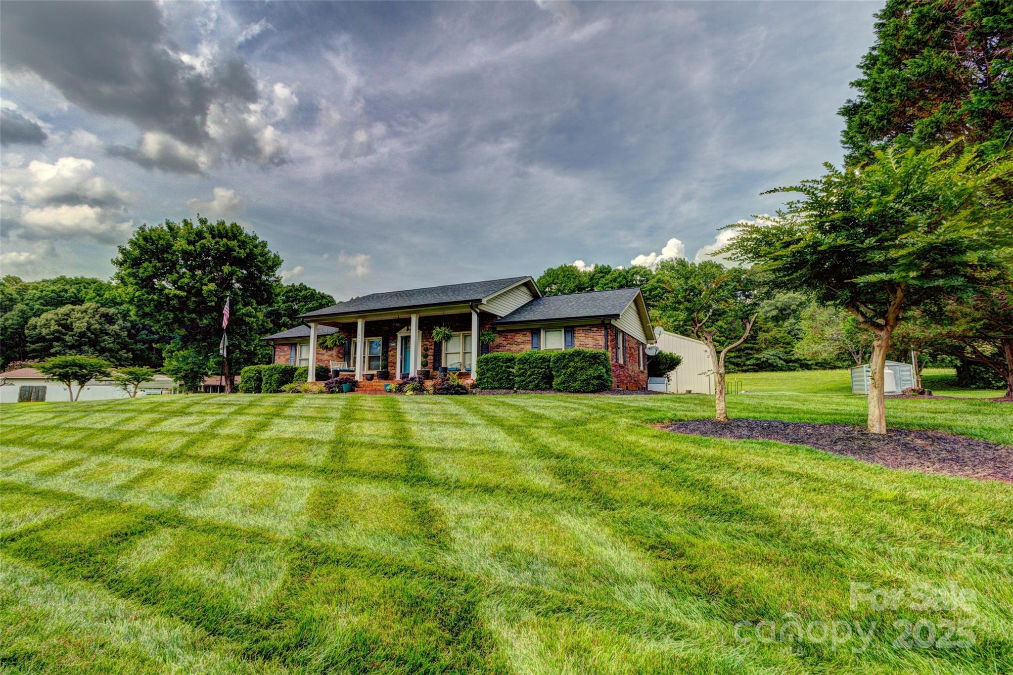253 Suncrest Road Cherryville, NC 28021 - Photo 2 of 33 a front view of a house with a yard table and chairs
