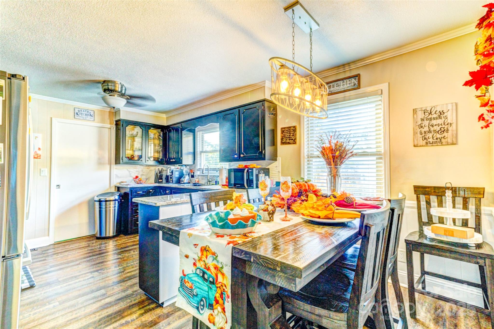 253 Suncrest Road Cherryville, NC 28021 - Photo 21 of 33 a view of a dining room with furniture and a chandelier