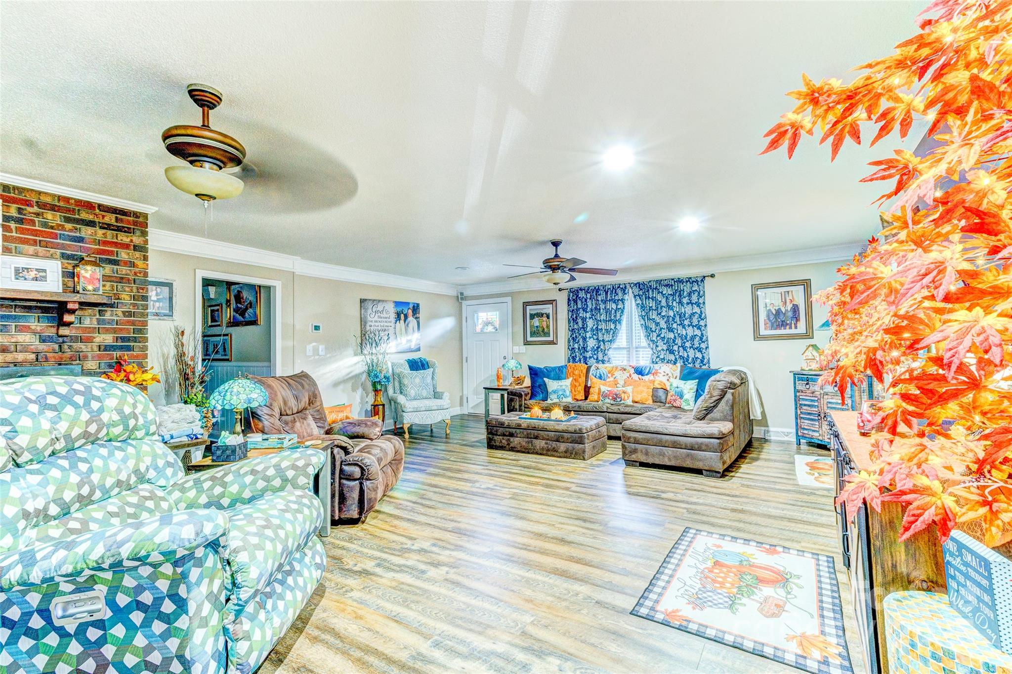 253 Suncrest Road Cherryville, NC 28021 - Photo 22 of 33 a living room with furniture floor to ceiling window and a flat screen tv