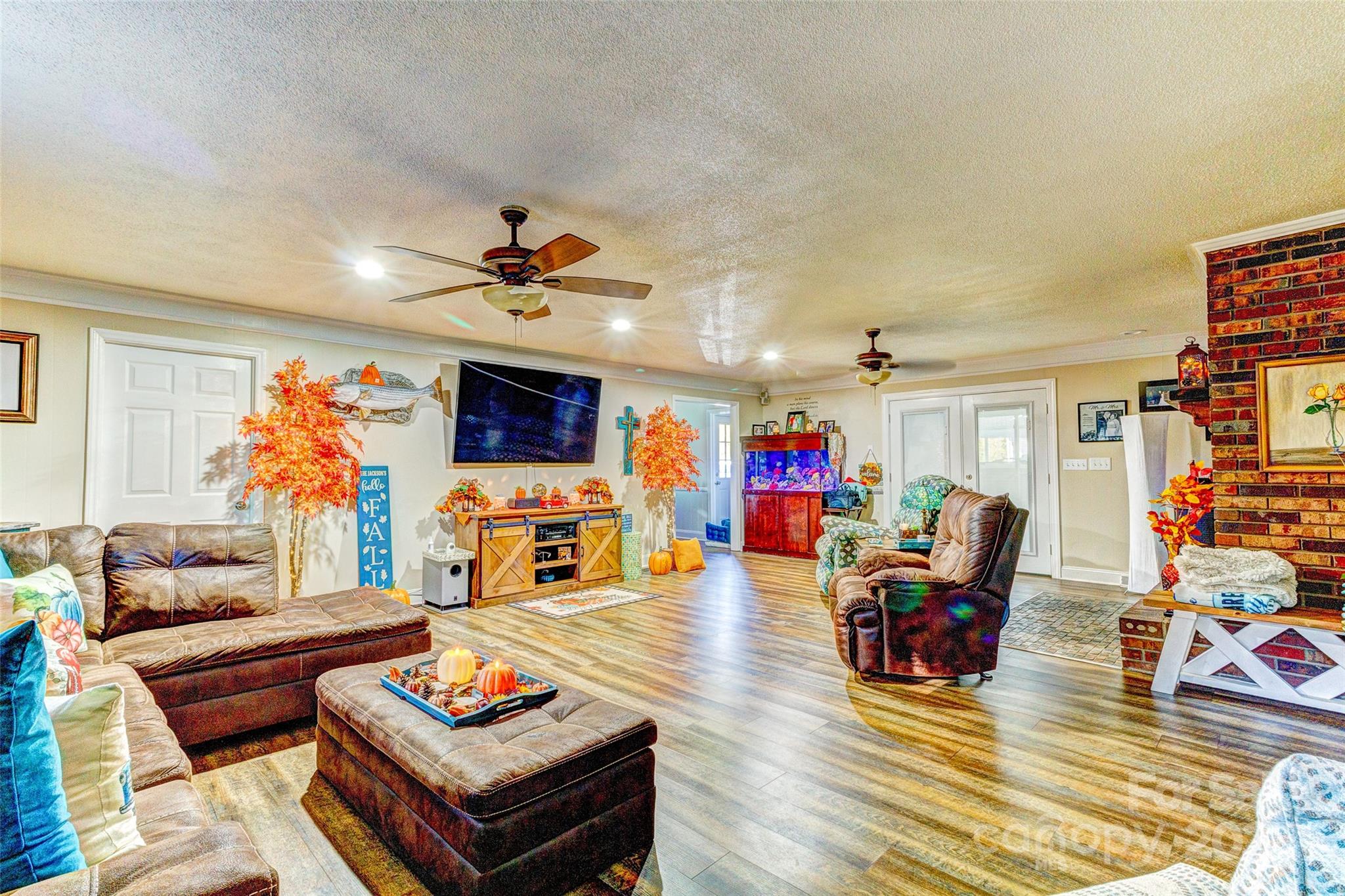 253 Suncrest Road Cherryville, NC 28021 - Photo 23 of 33 a living room with furniture a rug and a chandelier