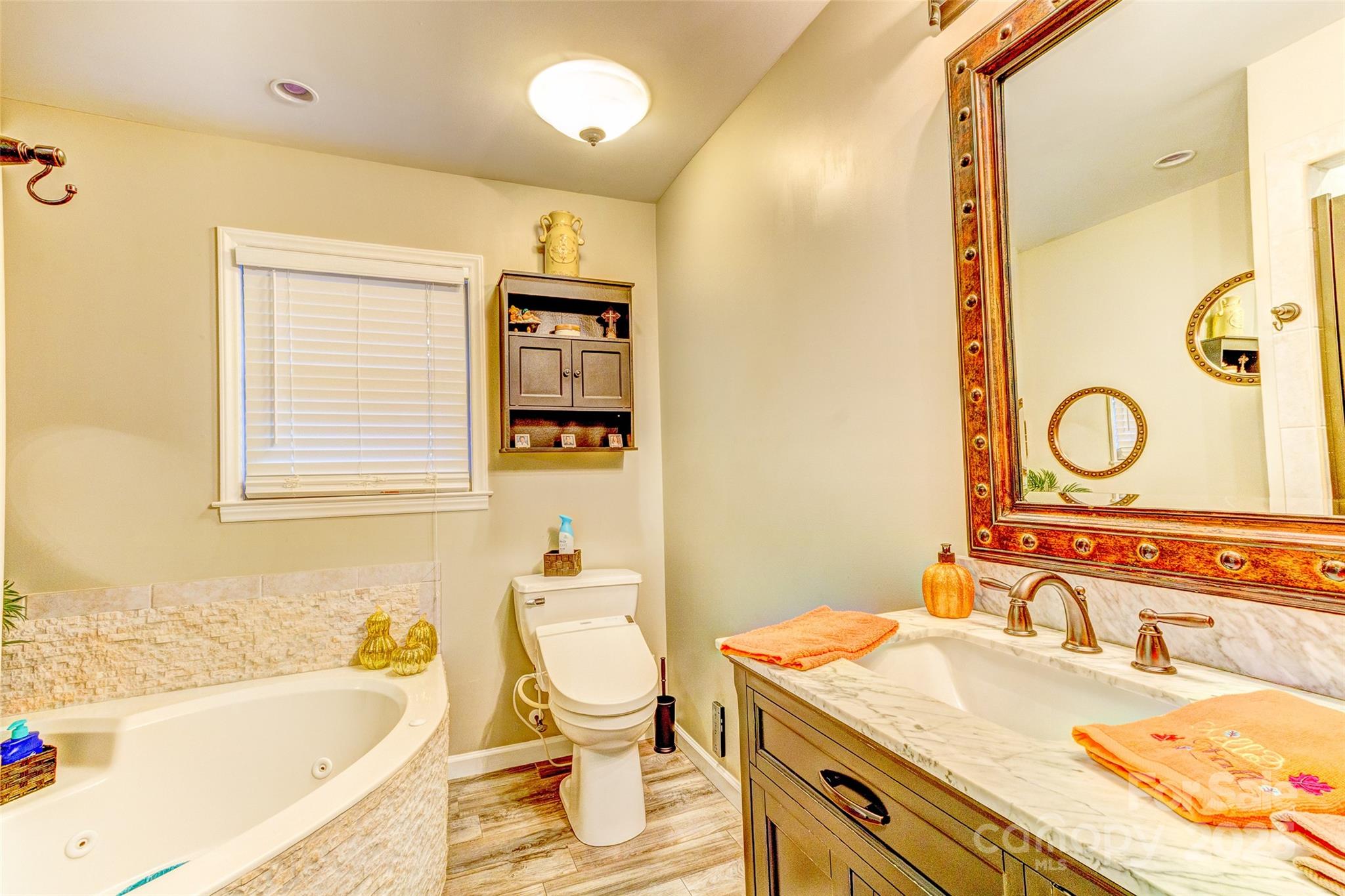 253 Suncrest Road Cherryville, NC 28021 - Photo 27 of 33 a bathroom with a sink a toilet and shower