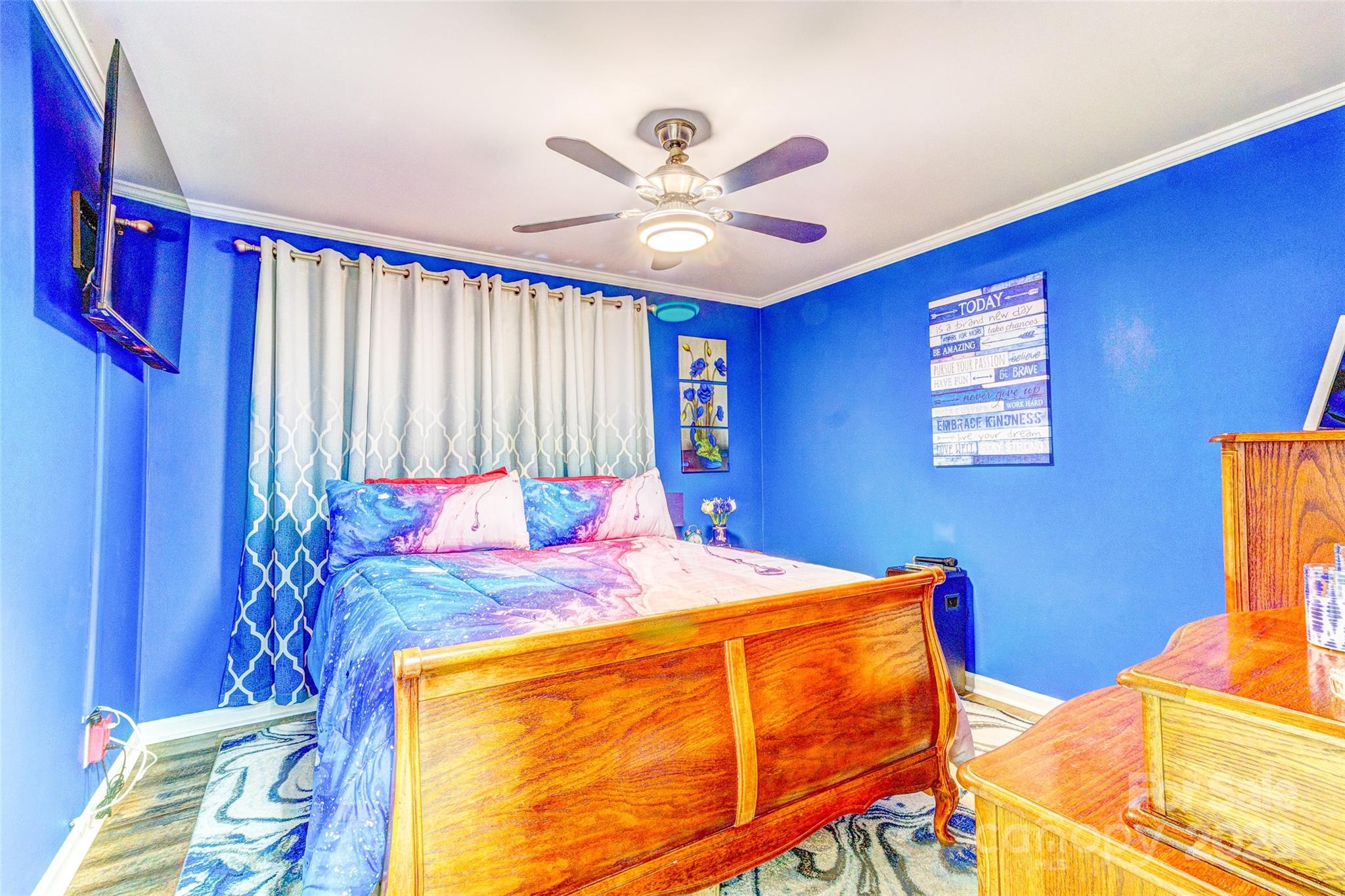 253 Suncrest Road Cherryville, NC 28021 - Photo 29 of 33 a bed room with a bed and a chandelier