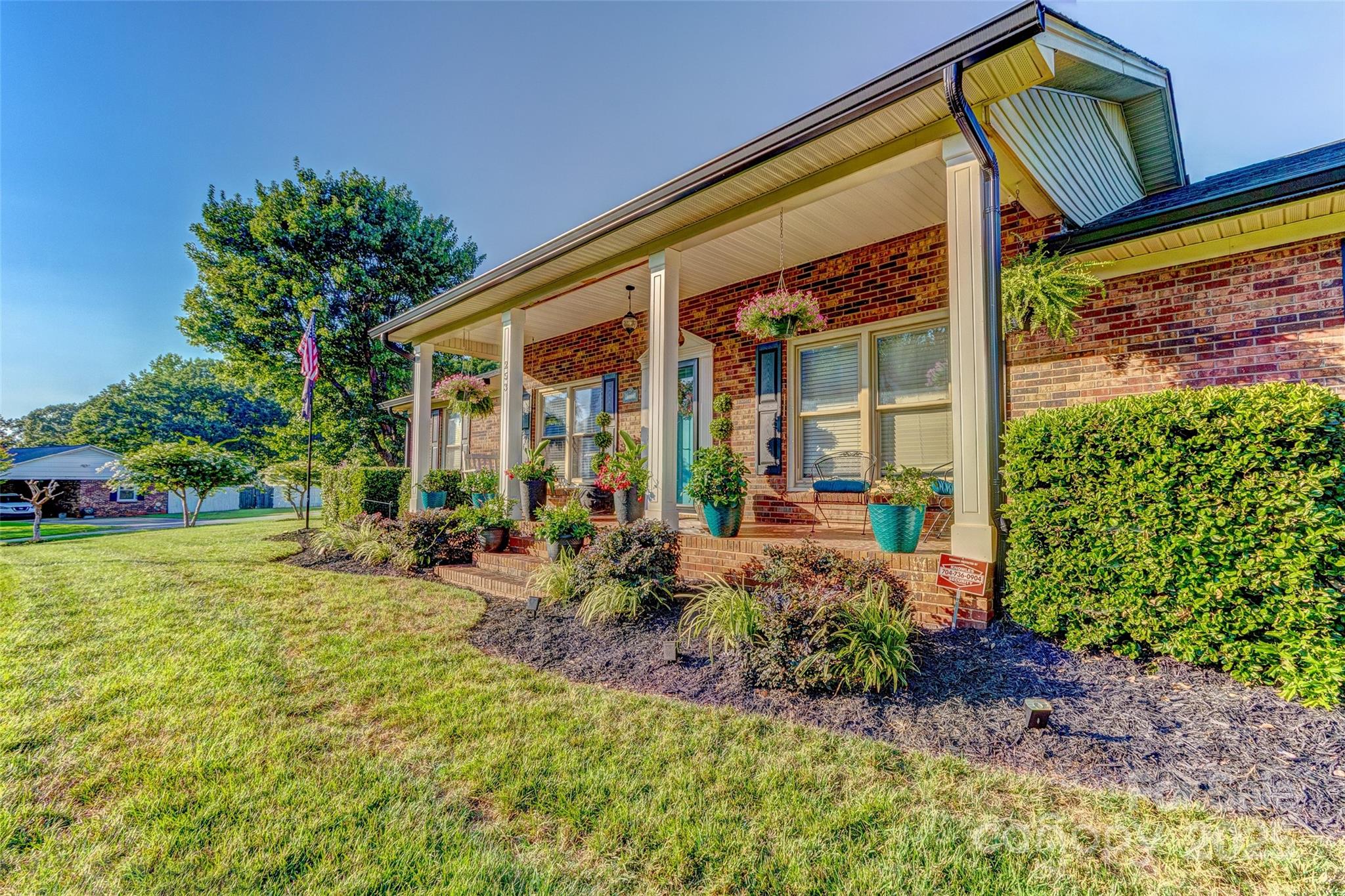 253 Suncrest Road Cherryville, NC 28021 - Photo 6 of 33 a view of a house with backyard sitting area and garden