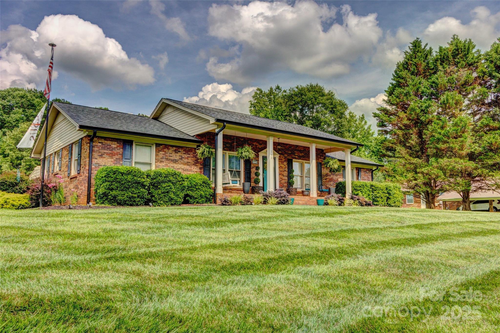 253 Suncrest Road Cherryville, NC 28021 - Photo 7 of 33 a front view of a house with a garden