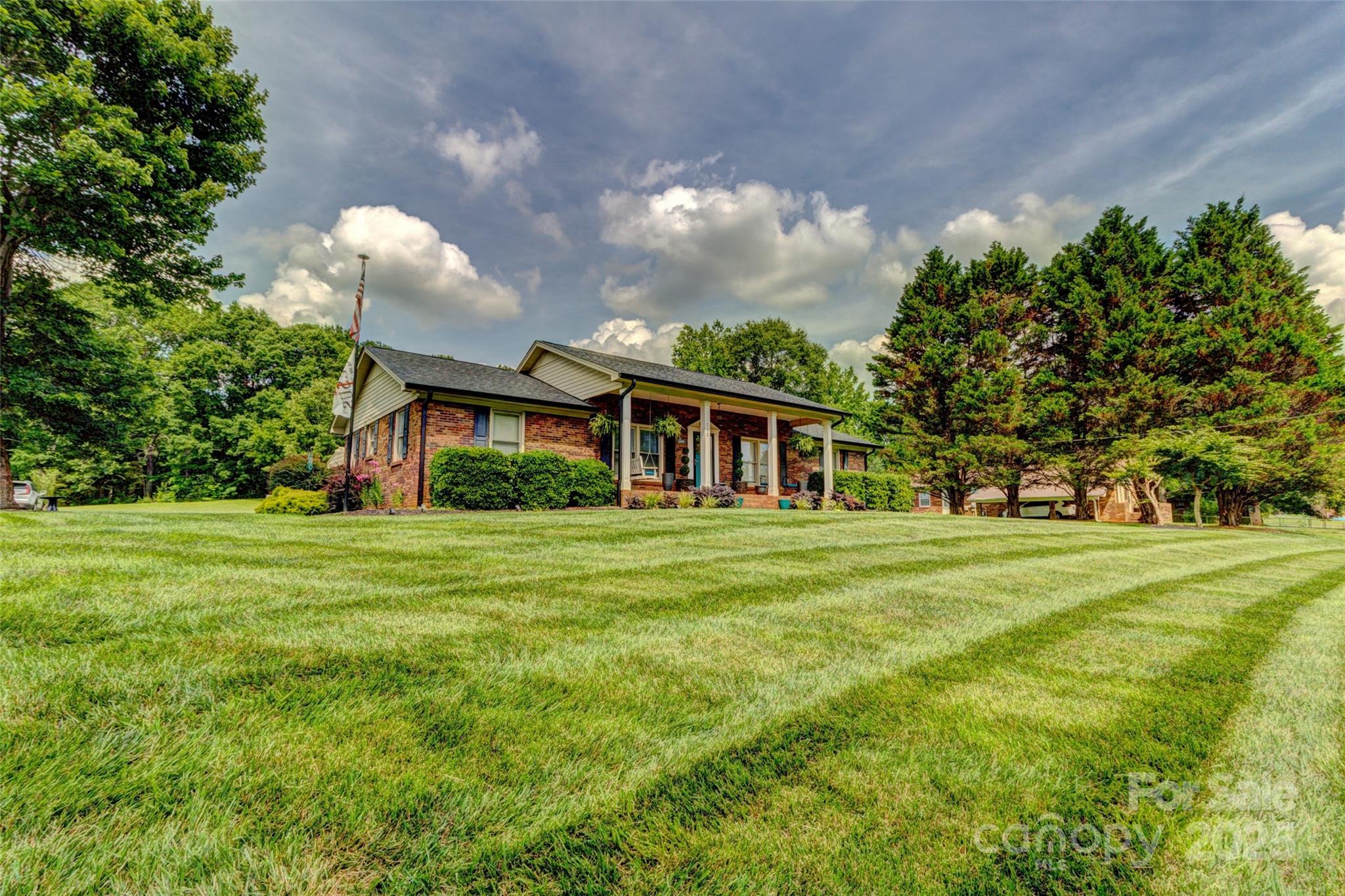 253 Suncrest Road Cherryville, NC 28021 - Photo 8 of 33 a front view of a house with a garden