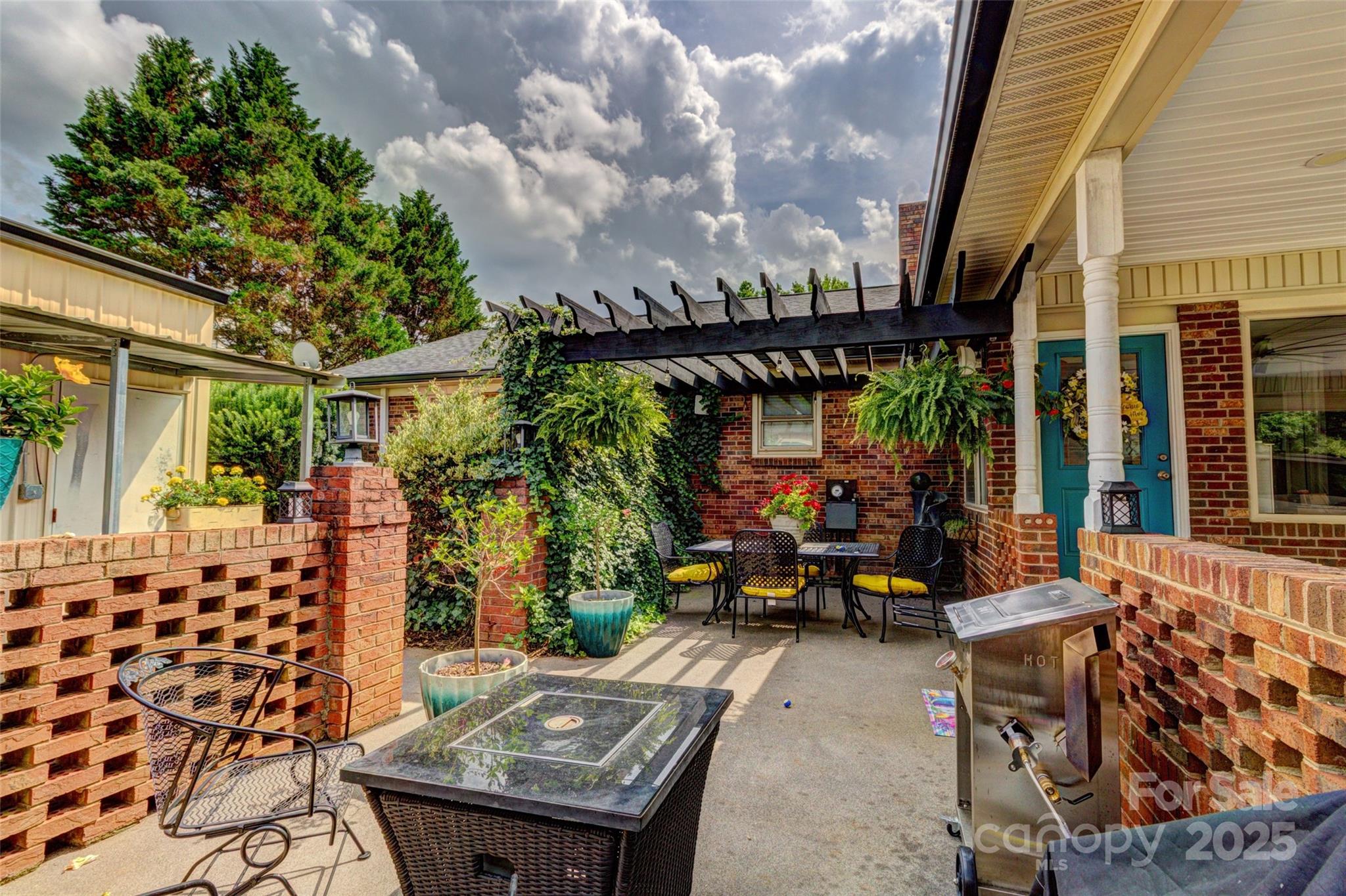 253 Suncrest Road Cherryville, NC 28021 - Photo 9 of 33 a view of a patio with table and chairs and potted plants