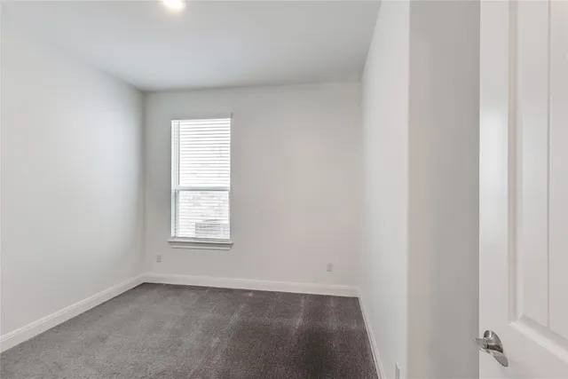 a bathroom with a double vanity sink and shower