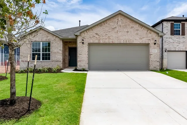 a view of a backyard with a garden