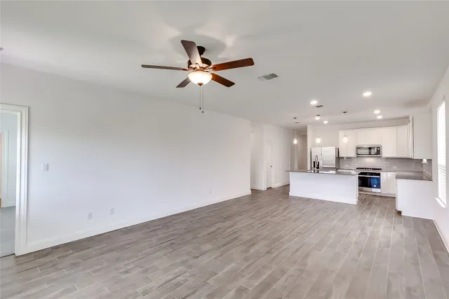 a kitchen with a sink and chandelier