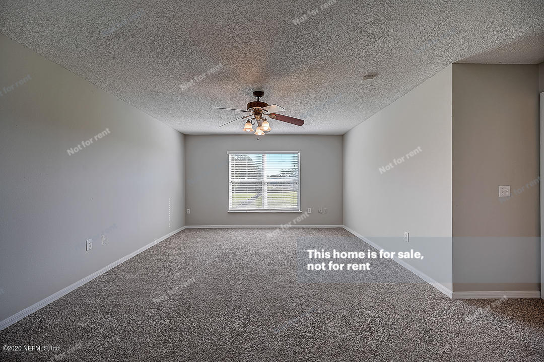 7115 High Bluff Road Jacksonville, FL 32244 - Photo 18 of 45 a view of an empty room and a window