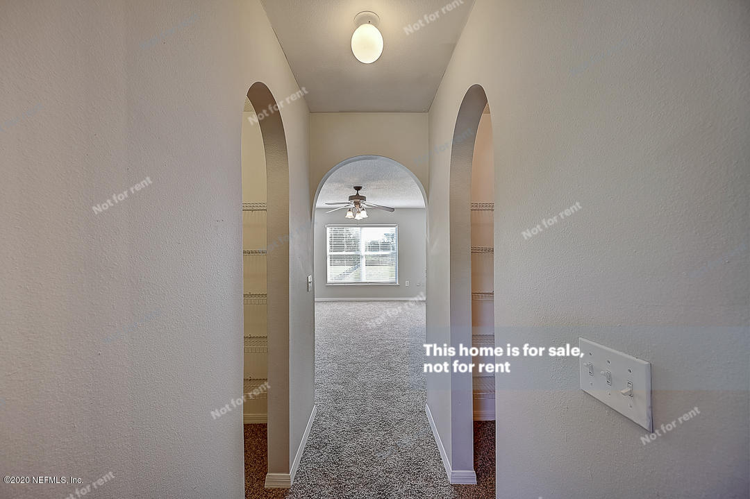 7115 High Bluff Road Jacksonville, FL 32244 - Photo 20 of 45 a view of a hallway with front door