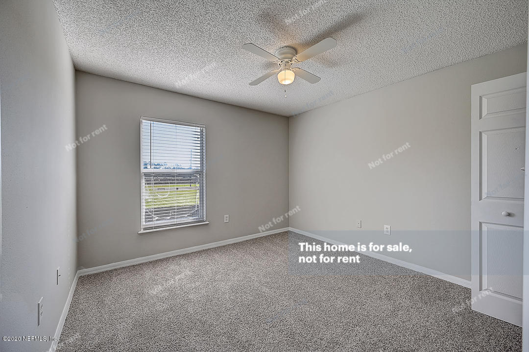 7115 High Bluff Road Jacksonville, FL 32244 - Photo 24 of 45 a view of an empty room with a window