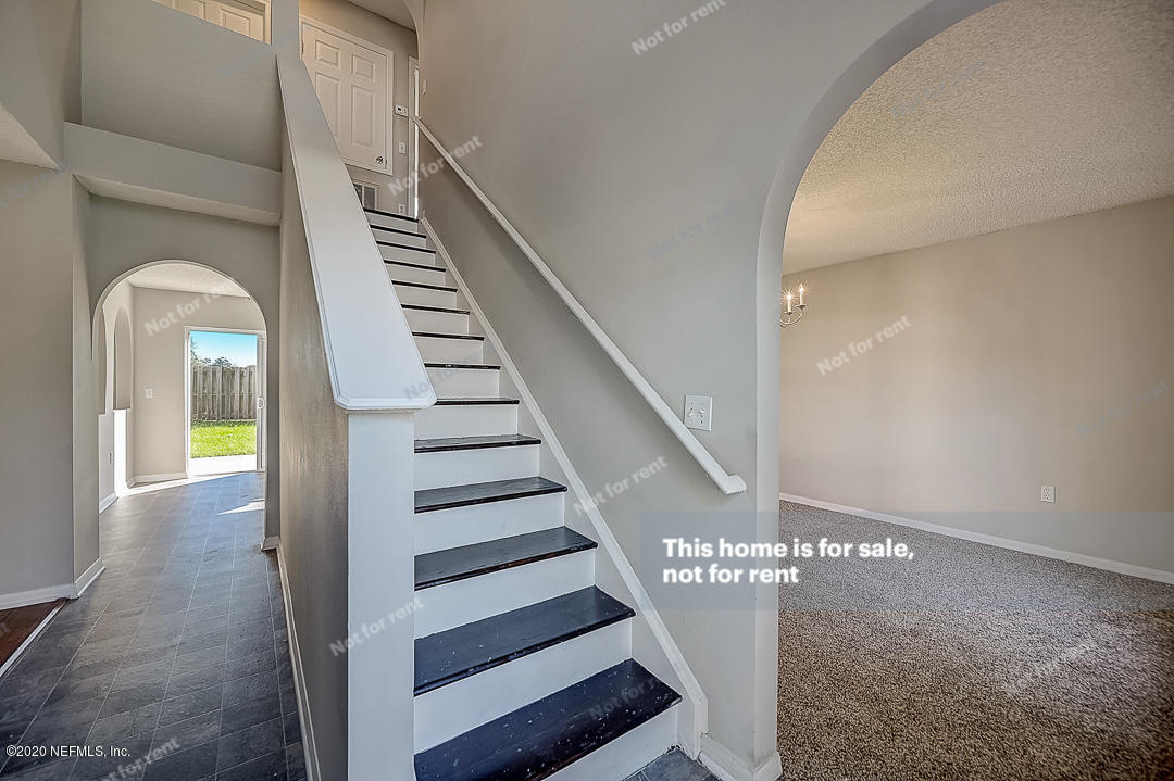 7115 High Bluff Road Jacksonville, FL 32244 - Photo 29 of 45 a view of entryway and hall with wooden floor