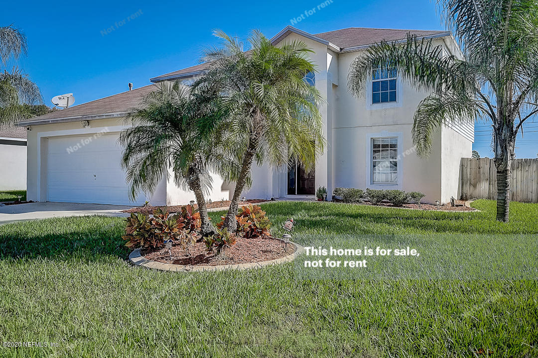 7115 High Bluff Road Jacksonville, FL 32244 - Photo 40 of 45 a garden with palm trees